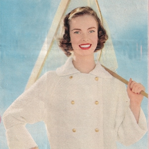 May include: A white double-breasted jacket with gold buttons and a white collar. The jacket is worn over red and white striped shorts.