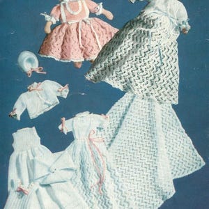 May include: A set of crocheted doll clothes, including a pink dress, a white dress, a white jacket, and a white bonnet. The doll clothes are made with delicate lace and are perfect for a vintage-inspired doll.