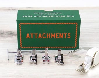 Singer Featherweight (Vintage Original).  Boxed Set of Attachments.  several 1/4" feet; open toe, scant, true, and patchwork, plus a walking
