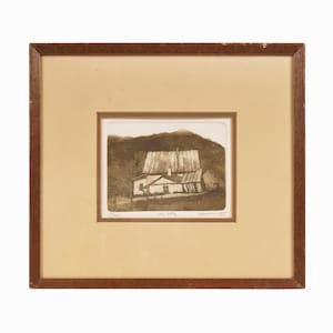 May include: A framed black and white print of a house with a gabled roof and a mountain in the background. The print is titled "Stone Dwelling" and signed "Edmund Blair 1993".
