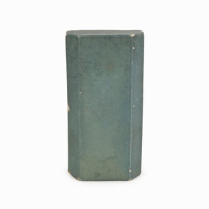 May include: A dark green rectangular box with slightly rounded edges.