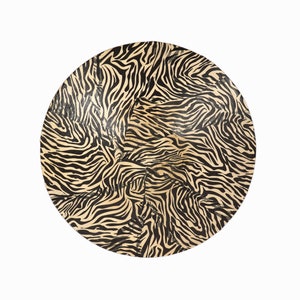 May include: A round, black and cream colored serving tray with a zebra print pattern.