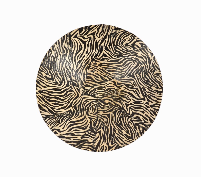 May include: A round, black and cream colored serving tray with a zebra print pattern.