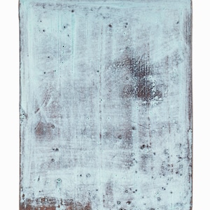 May include: A light blue, rectangular wooden sign with a distressed, aged look. The surface has a light blue paint with a white wash, showing the wood grain underneath. The edges of the sign are slightly rounded.