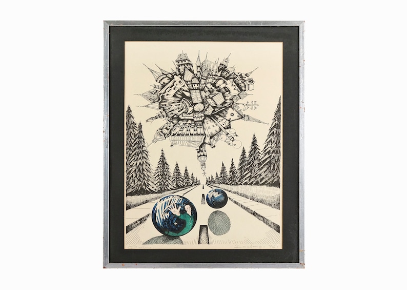 May include: A black and white framed print of a surrealist drawing. The drawing depicts a city floating in the sky above a road with two blue globes on the road. The city is made up of many buildings and towers.
