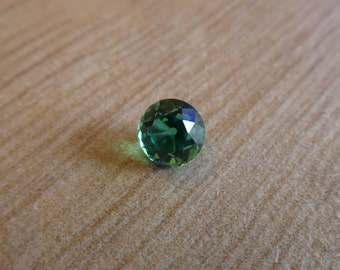 Glowing Old European Antique Cut Round Emerald 1.05 full carats 6 millimeters