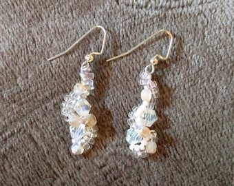 Spiral white beaded dangle earrings