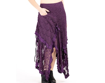 May include: A long, purple lace skirt with a high-low hemline and a ruffled trim. The skirt has a side pocket and is tied at the waist.