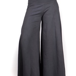 May include: Gray wide-leg pants with a wide, flowing silhouette. The pants have a simple, relaxed fit and a comfortable, casual style.