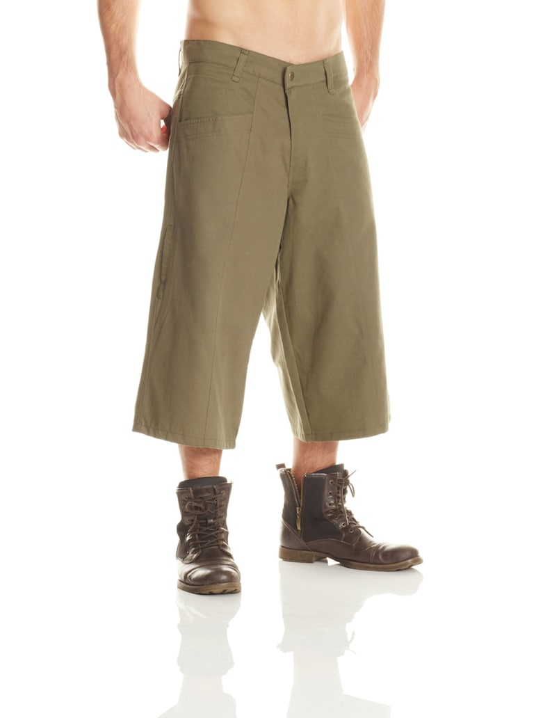 May include: A pair of olive green cargo-style shorts with a button fly and belt loops. The shorts have a relaxed fit and are made of a lightweight fabric.