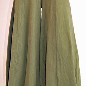 May include: Olive green wide-leg pants with a wide waistband and a flowing silhouette.