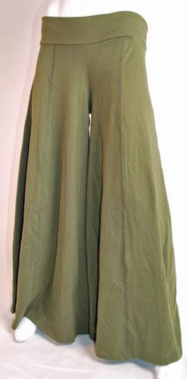 May include: Olive green wide-leg pants with a wide waistband and a flowing silhouette.