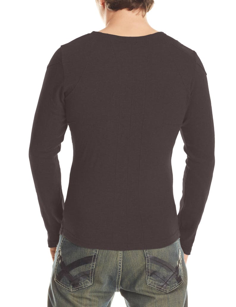 May include: Dark brown long-sleeve shirt with a crew neck. The shirt has a fitted design with seams running down the back. The model is wearing blue denim jeans with decorative stitching on the back pockets.