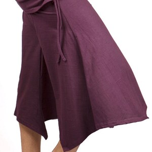 May include: A purple, flowing, wide-legged,  culottes-style pant with a drawstring waist.