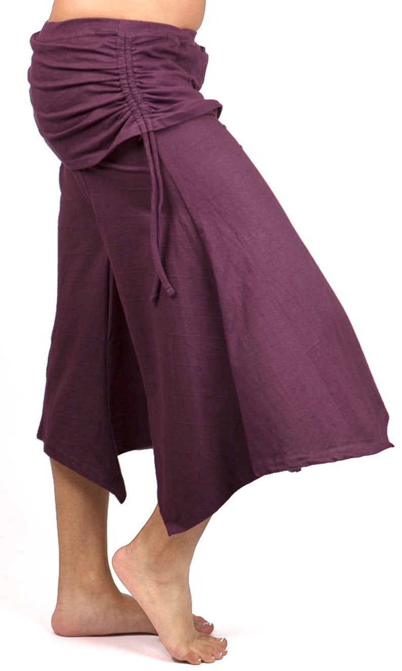 May include: A purple, flowing, wide-legged,  culottes-style pant with a drawstring waist.