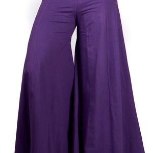 May include: Purple wide-leg pants with a high waist and a flowing silhouette.