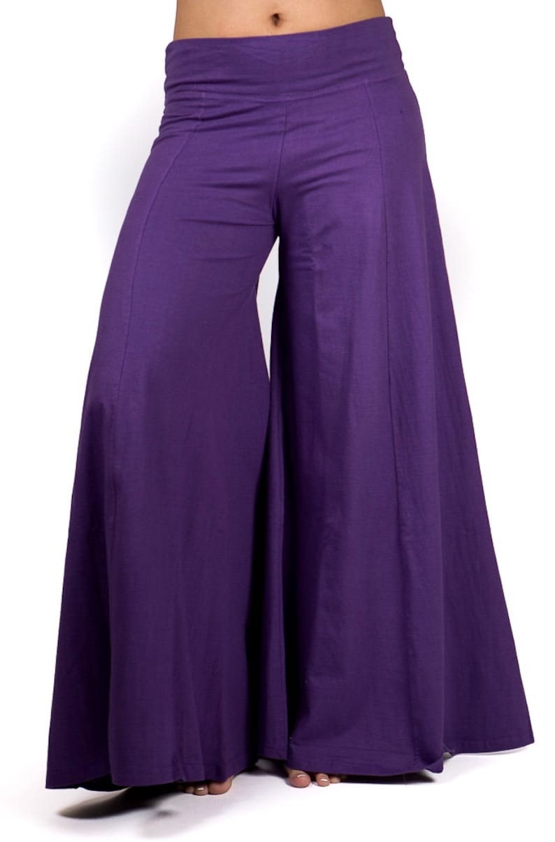 May include: Purple wide-leg pants with a high waist and a flowing silhouette.