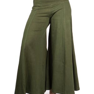May include: A pair of wide-legged, olive green pants with a relaxed fit. The pants have a simple design and a comfortable look.
