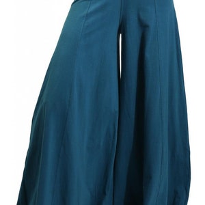 May include: Teal wide-leg pants with a wide waistband and a flowing silhouette.