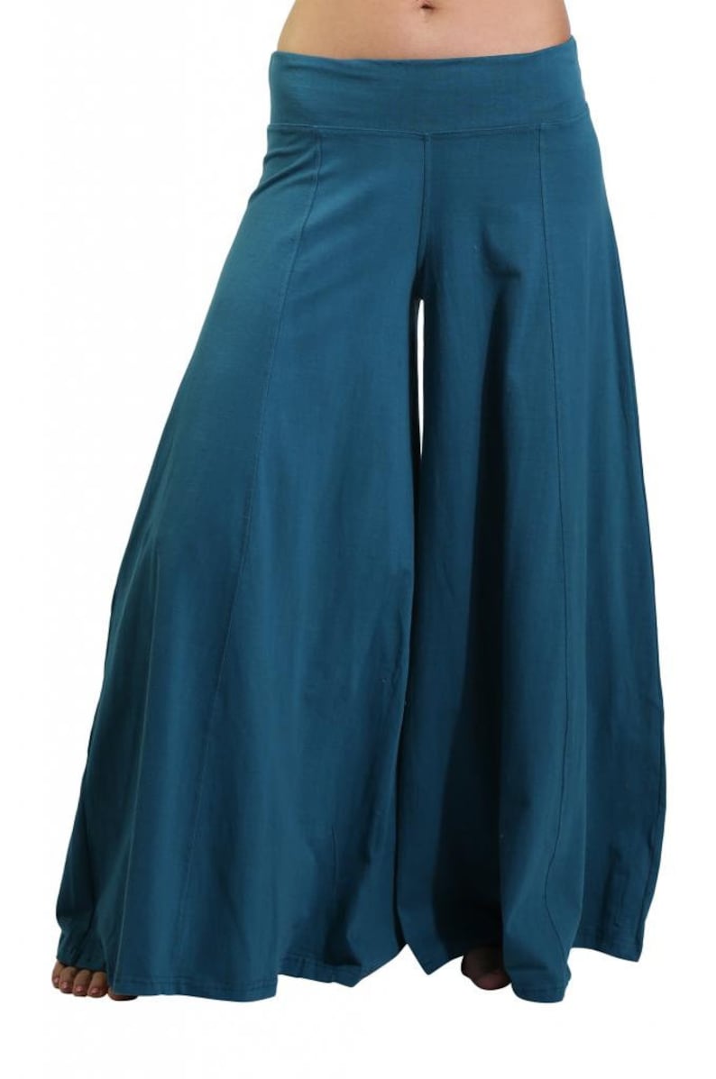 May include: Teal wide-leg pants with a wide waistband and a flowing silhouette.