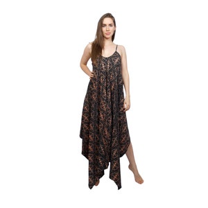 May include: A black maxi dress with a brown floral pattern. The dress has a V-neckline and thin straps. The dress is asymmetrical and has a flowing skirt.