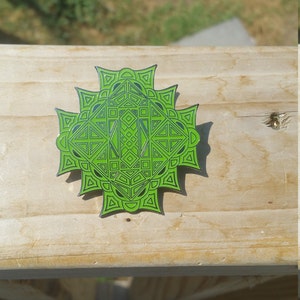 Sunburst starburst green glow variant geometric pattern hard enamel limited edition heady hat lapel pin ships free in the united states