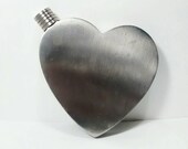 Heart shaped metal flask.
