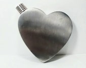 Heart shaped metal flask.