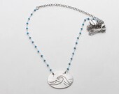 A swell of waves on turquoise beaded chain. sterling silver over brass or antique matte brass.