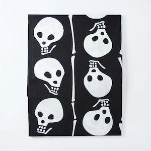 May include: Black and white fabric with a repeating pattern of skulls and bones. The skulls are stylised and have a simple design.