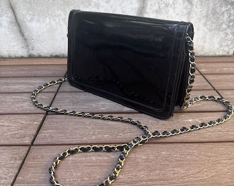 La Regale black channel style purse with gold tone handle