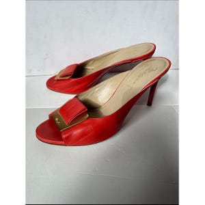 Bruno Magli leather mules with a gold-tone hardware plaque image 1