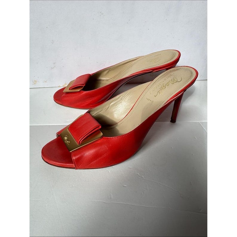 Bruno Magli leather mules with a gold-tone hardware plaque image 1