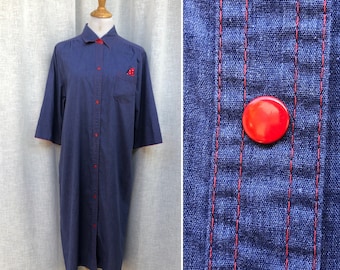 Vintage polyester blue denim button down shirt dress with red accents made by Models Coat