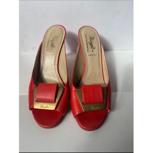 Bruno Magli leather mules with a gold-tone hardware plaque image 3