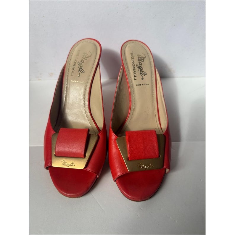 Bruno Magli leather mules with a gold-tone hardware plaque image 3