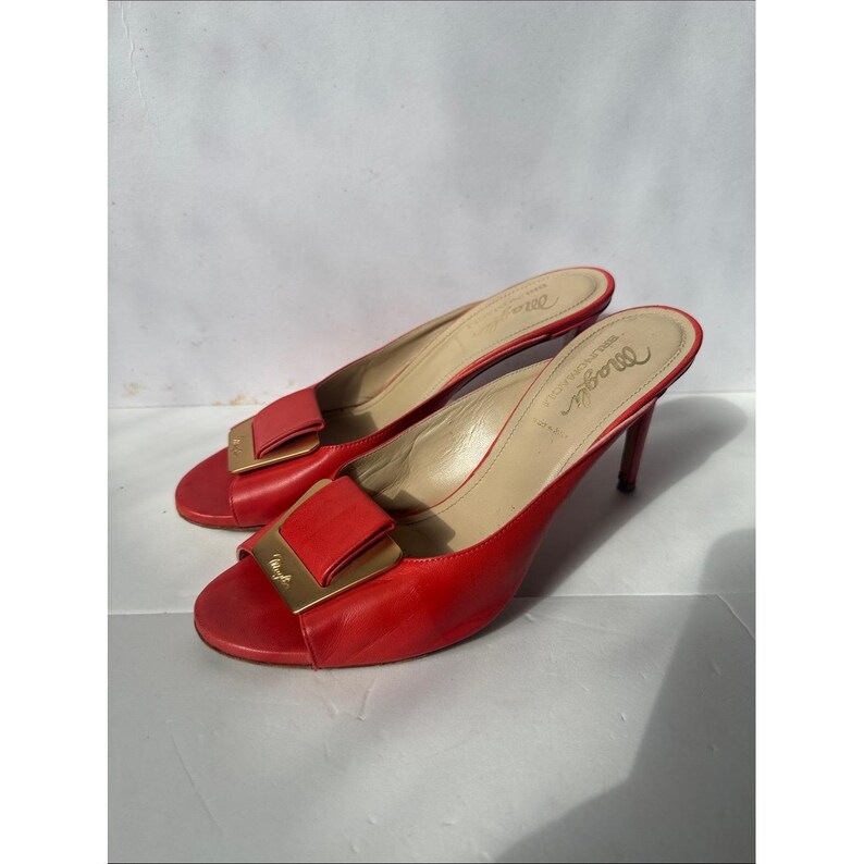 Bruno Magli leather mules with a gold-tone hardware plaque image 2