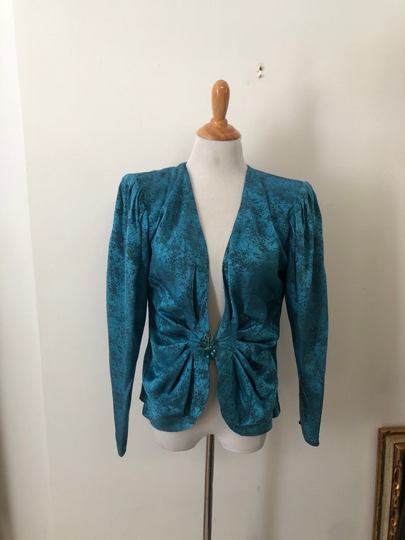 Circa 1980’s turquoise linen silk blend puffy slee