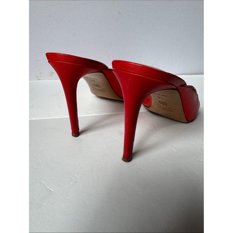 Bruno Magli leather mules with a gold-tone hardware plaque image 9