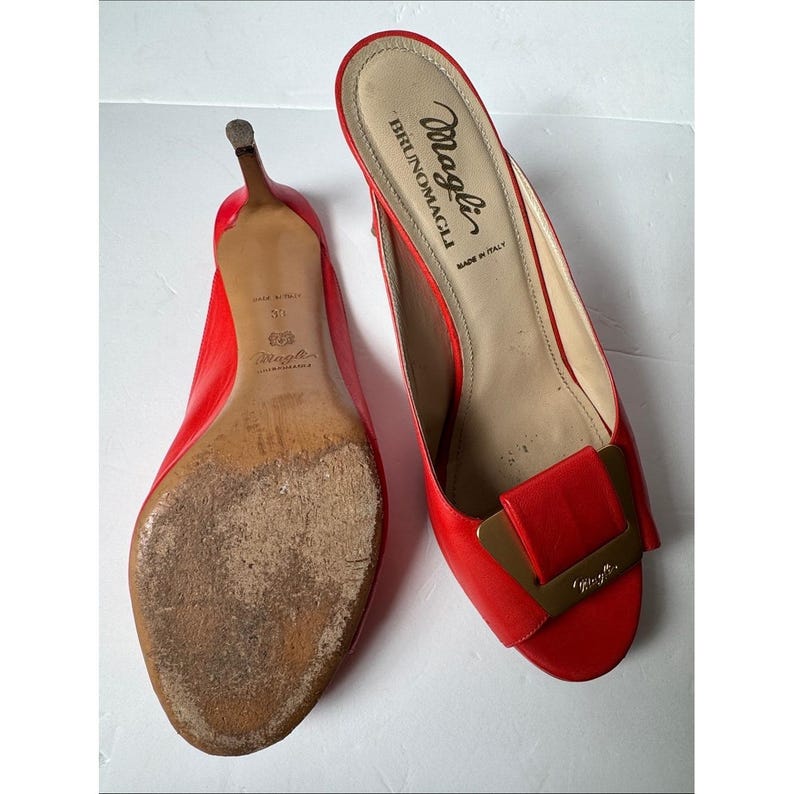 Bruno Magli leather mules with a gold-tone hardware plaque image 6