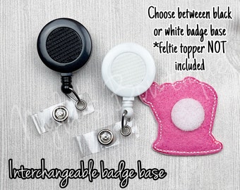 May include: Two interchangeable badge reels, one black and one white, with clear plastic badge holders.  Choose between black or white badge base *feltie topper NOT included*.