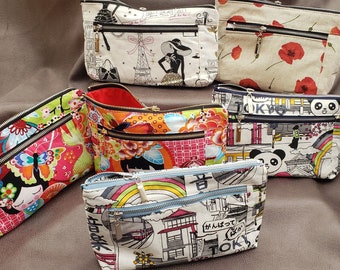 Several pockets, coin purse, 2 zippers, in cotton fabric.