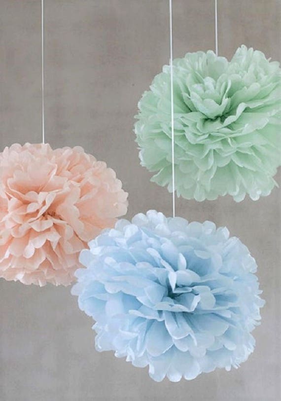 Tissue paper pom poms and wedding bouquet