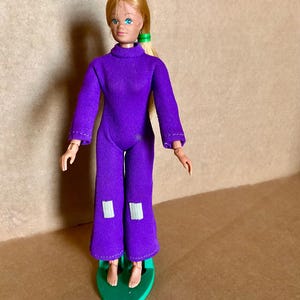 Vintage 1976 Mego Corp Doll: 7.5&quot; Purple Jumpsuit, Original Stand