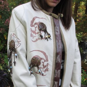 White leather Shaman Jacket with dreadlock skulls and spiked and studded cuff Womans size small
