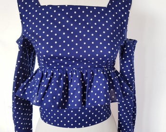 Pretty polka dot peplum top in a UK size Xs or 6, US size 4