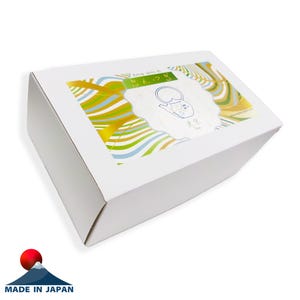 May include: A white cardboard box with a decorative window showing a colourful design of wavy lines in shades of yellow, green, and blue. The window displays a teapot illustration and Japanese text. The box is labelled "Made in Japan".