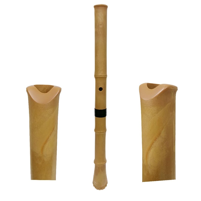 May include: A light brown bamboo-style flute featuring a smooth, cylindrical body with segmented nodes, a single circular finger hole, and a black band accent. The instrument is shown in full length alongside two close-up views of the mouthpiece.
