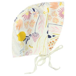 May include: A white baby bonnet with a floral print featuring pink, yellow, orange, and blue flowers. The bonnet has a tie at the back.