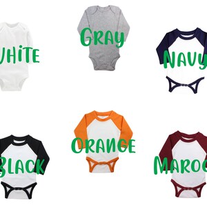 May include: Six baby onesies in different colors with a baseball tee design. The onesies are white, gray, navy, orange, black, and maroon. The text on the onesies reads "White", "Gray", "Navy", "Orange", "Black", and "Maroon".